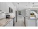 Bright kitchen with modern appliances, marble counters, white cabinets, and an open layout at 119 White Pine Dr, Rotonda West, FL 33947