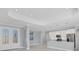 A large living room and modern kitchen with stainless appliances and a granite countertop island at 119 White Pine Dr, Rotonda West, FL 33947