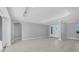 Bright living room features tile flooring, recessed lighting, and decorative tray ceiling at 119 White Pine Dr, Rotonda West, FL 33947