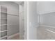 Walk-in closet with custom shelving and easy access to bedroom at 119 White Pine Dr, Rotonda West, FL 33947