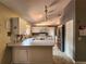 Bright kitchen featuring neutral tones, track lighting, and stainless steel appliances at 13278 Carter Ave, Port Charlotte, FL 33981