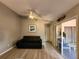 Cozy living room featuring bright natural lighting, a ceiling fan, and tile flooring at 13278 Carter Ave, Port Charlotte, FL 33981