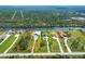 Aerial view of a single-Gathering home in Florida with a long driveway and access to a waterway at 13307 Eisenhower Dr, Port Charlotte, FL 33953