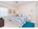 Guest bedroom with a queen bed and coastal decor at 13307 Eisenhower Dr, Port Charlotte, FL 33953