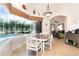 Breakfast nook with views of the pool and lanai at 13307 Eisenhower Dr, Port Charlotte, FL 33953