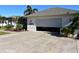 Home with attached garage and sunshade at 13307 Eisenhower Dr, Port Charlotte, FL 33953