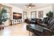 Gathering room boasts leather furniture and a large TV at 13307 Eisenhower Dr, Port Charlotte, FL 33953