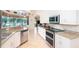 Modern kitchen with stainless steel appliances and granite countertops at 13307 Eisenhower Dr, Port Charlotte, FL 33953