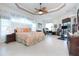Spacious main bedroom with king-size bed and exercise equipment at 13307 Eisenhower Dr, Port Charlotte, FL 33953