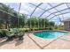 Relaxing screened pool and patio area at 13307 Eisenhower Dr, Port Charlotte, FL 33953