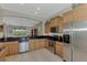 Modern kitchen features sleek countertops, stainless steel appliances, and abundant cabinet space at 13376 Creekside Ln, Port Charlotte, FL 33953