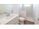 Modern bathroom with a white vanity, tiled shower with glass partition, and neutral finishes at 159 Colony Point Dr, Punta Gorda, FL 33950