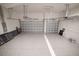 Spacious three car garage with epoxy floor and two automatic garage door openers at 159 Colony Point Dr, Punta Gorda, FL 33950