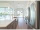 Modern kitchen with stainless steel appliances, a central island with quartz countertops, and water views at 159 Colony Point Dr, Punta Gorda, FL 33950