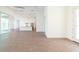 Open-concept living room with recessed lighting, wood flooring, and access to the kitchen and outdoor area at 159 Colony Point Dr, Punta Gorda, FL 33950