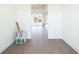 Open layout featuring wood floors and large windows, offering plenty of natural light at 159 Colony Point Dr, Punta Gorda, FL 33950