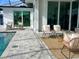 Covered patio with wicker furniture, an outdoor rug, and a view of the pool at 159 Colony Point Dr, Punta Gorda, FL 33950