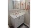 Bathroom with a white vanity, mirror, and neutral color scheme at 195 Sylvania, Englewood, FL 34223