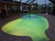 Night view of a tranquil, kidney-shaped pool with lighting at 195 Sylvania, Englewood, FL 34223