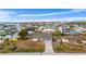 Aerial view of a home in a waterfront community, with easy access to canals and nearby waterways at 1954 Arkansas Ave, Englewood, FL 34224