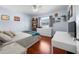 The bedroom has a window and contains a bed with soft linens and white furnishings at 1954 Arkansas Ave, Englewood, FL 34224