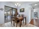 Bright dining room with sliding glass doors to the lanai and pool, and views of the outdoor space at 1954 Arkansas Ave, Englewood, FL 34224