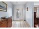 Spacious foyer featuring tile flooring, neutral walls, and a warm welcome to the home at 1954 Arkansas Ave, Englewood, FL 34224