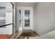 Charming front door entrance with a decorative welcome mat and brick accents, inviting you to come inside at 1954 Arkansas Ave, Englewood, FL 34224