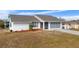 Charming home featuring a well-maintained lawn and manicured landscaping for great curb appeal at 1954 Arkansas Ave, Englewood, FL 34224