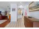 Inviting hallway with neutral walls, opening to the living spaces, creating a seamless flow throughout the home at 1954 Arkansas Ave, Englewood, FL 34224