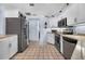 Kitchen with stainless refrigerator and stainless appliances at 1954 Arkansas Ave, Englewood, FL 34224