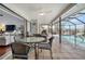 Outdoor lanai featuring a large dining area with views of the pool and living area at 1954 Arkansas Ave, Englewood, FL 34224