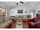 Bright living room featuring hardwood floors, comfortable couches, and neutral decor creating an inviting atmosphere at 1954 Arkansas Ave, Englewood, FL 34224