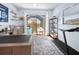 Bright home office with a desk, treadmill and relaxing pool view at 1954 Arkansas Ave, Englewood, FL 34224