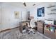 Cozy home office features wood floors, functional desk, and neutral paint at 1954 Arkansas Ave, Englewood, FL 34224