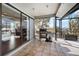 Covered patio with tile flooring features a grill and outdoor furniture, ideal for outdoor cooking and entertaining at 1954 Arkansas Ave, Englewood, FL 34224