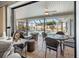 Open patio area featuring outdoor seating, fan and view of the pool at 1954 Arkansas Ave, Englewood, FL 34224