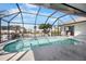 Inviting screened-in pool with beautiful waterfront views and ample seating for relaxing and enjoying the Florida sunshine at 1954 Arkansas Ave, Englewood, FL 34224