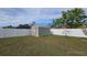 Spacious backyard with storage shed and white vinyl fence at 23046 Foote Ave, Port Charlotte, FL 33952