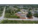 Aerial view of a home surrounded by lush greenery, showcasing its private and tranquil setting at 7330 Regina Dr, Englewood, FL 34224
