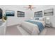 Comfortable bedroom with a plush bed, modern decor, and plenty of natural light at 7330 Regina Dr, Englewood, FL 34224