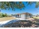 Charming home with an attached garage, well-maintained lawn, and inviting curb appeal at 7330 Regina Dr, Englewood, FL 34224
