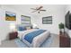 Beautiful main bedroom features plush carpeting, modern furniture, and two windows providing natural light at 7330 Regina Dr, Englewood, FL 34224