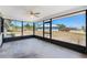 A blank screened-in porch with a neutral concrete floor, ideal for customization and enjoying outdoor space at 7330 Regina Dr, Englewood, FL 34224