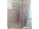 Accessible shower with seat and shower curtain at 91 Gasparilla Way, Placida, FL 33946