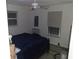 View of a bedroom with carpet floors, a large bed, and a window at 91 Gasparilla Way, Placida, FL 33946