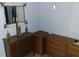 Bedroom features a mirror and dresser with ample storage space at 91 Gasparilla Way, Placida, FL 33946