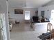 The living room has neutral walls, tile flooring and a ceiling fan at 91 Gasparilla Way, Placida, FL 33946