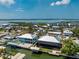 An aerial view showcasing waterfront homes, canals, boat docks, and lush surroundings at 9240 Pine Cove Dr, Englewood, FL 34224