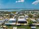 Aerial view of the homes on the water, the canals and landscaping at 9240 Pine Cove Dr, Englewood, FL 34224